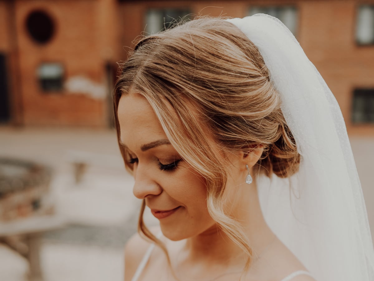Beautiful bride with elegant updo hairstyle