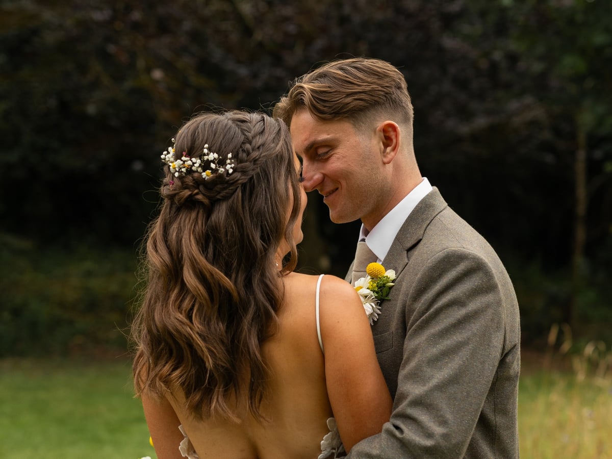 Happy bride with stunning wedding hairstyle